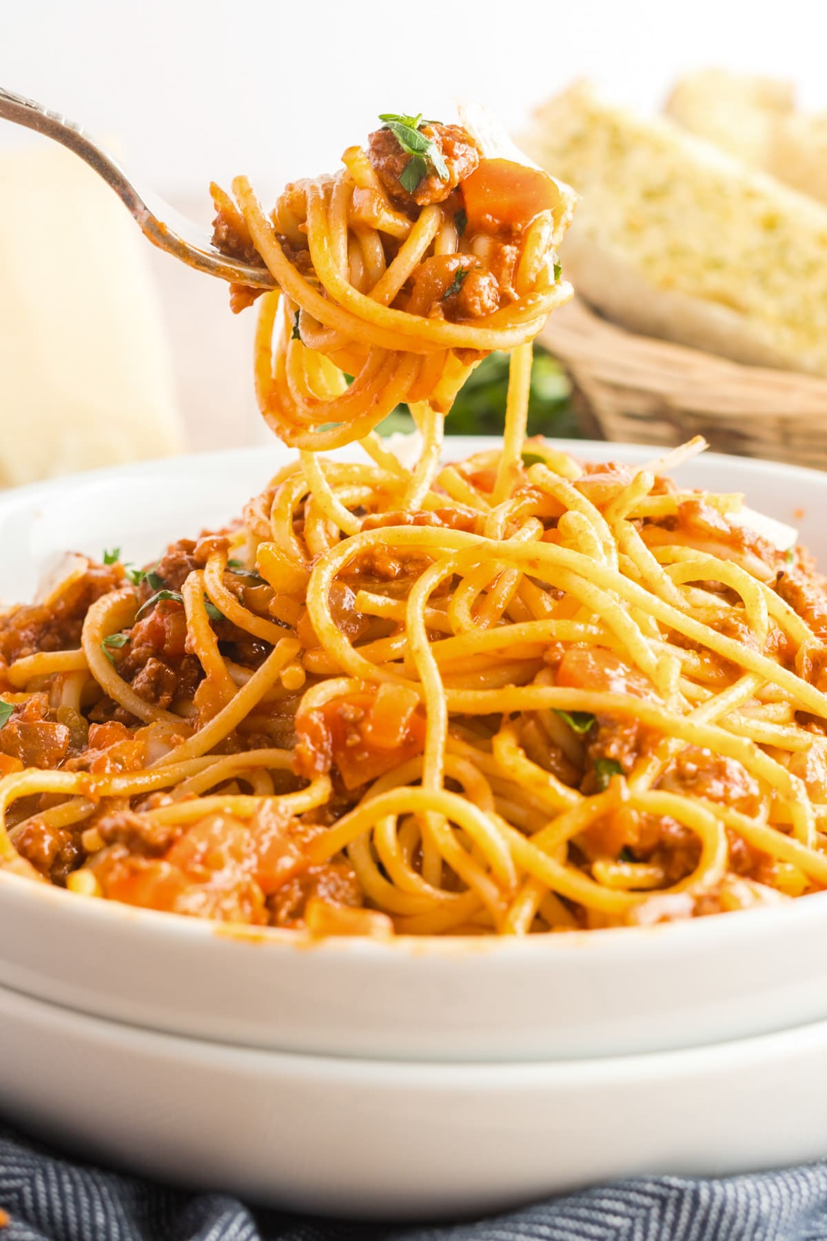 spaghetti bolognese twirled on a fork