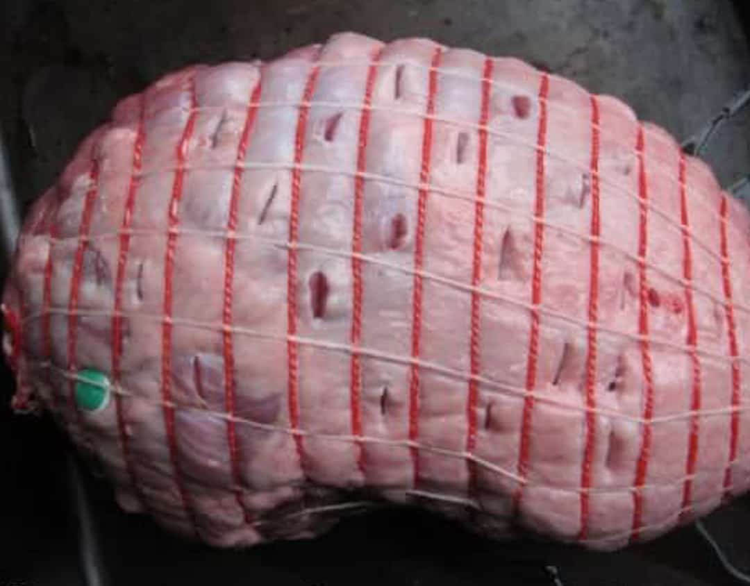 boneless leg of lamb, with cuts in it for stuffing garlic and rosemary in.