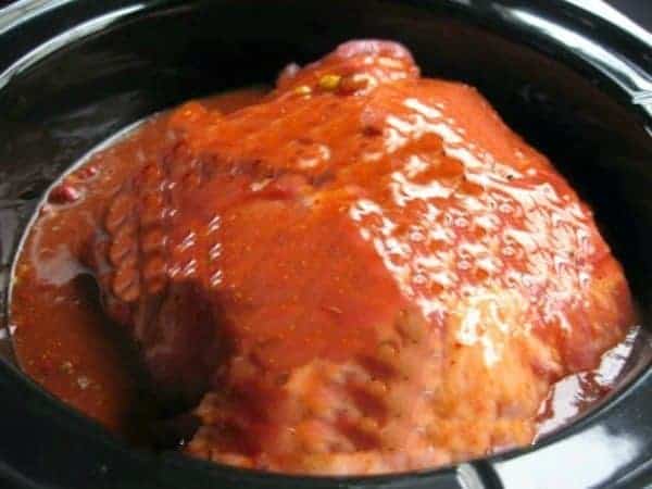 crockpot with pork ready to cook pulled pork