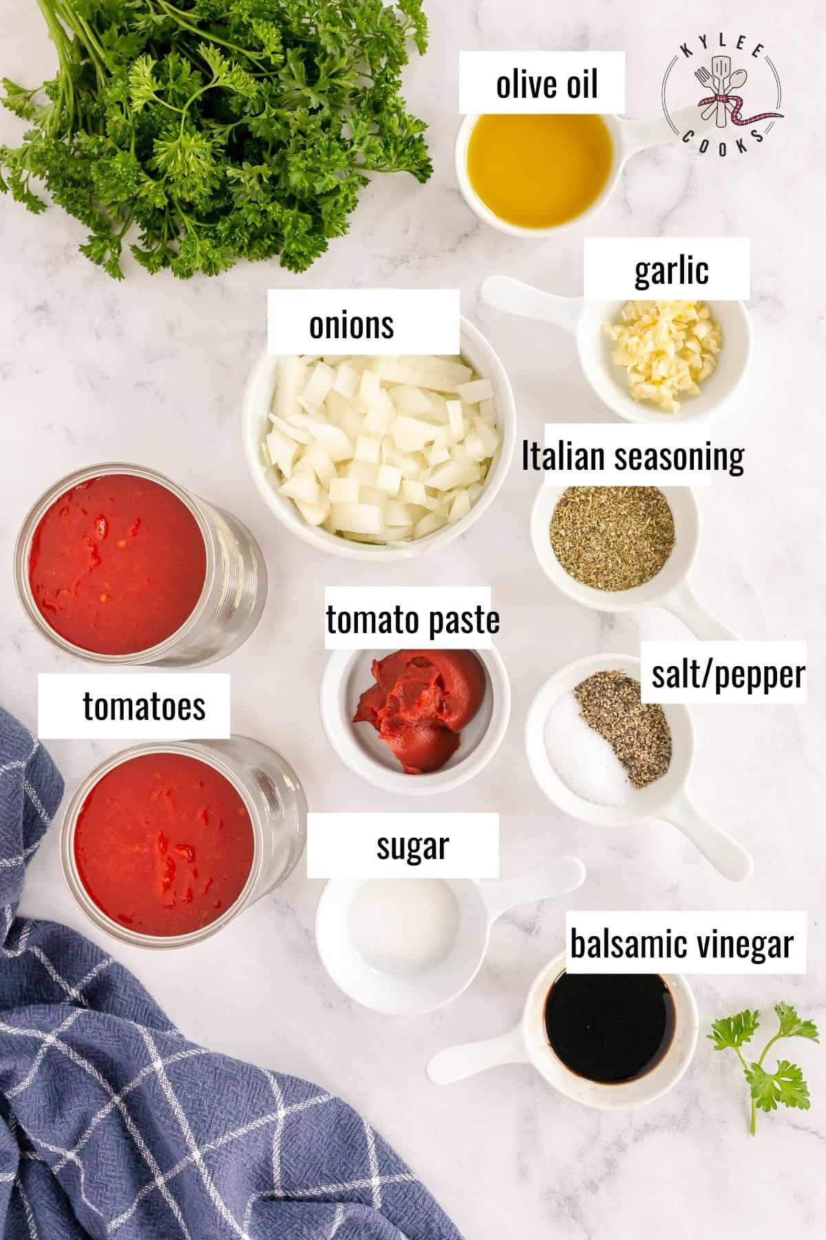 ingredients to make marinara sauce from scratch laid out and labeled