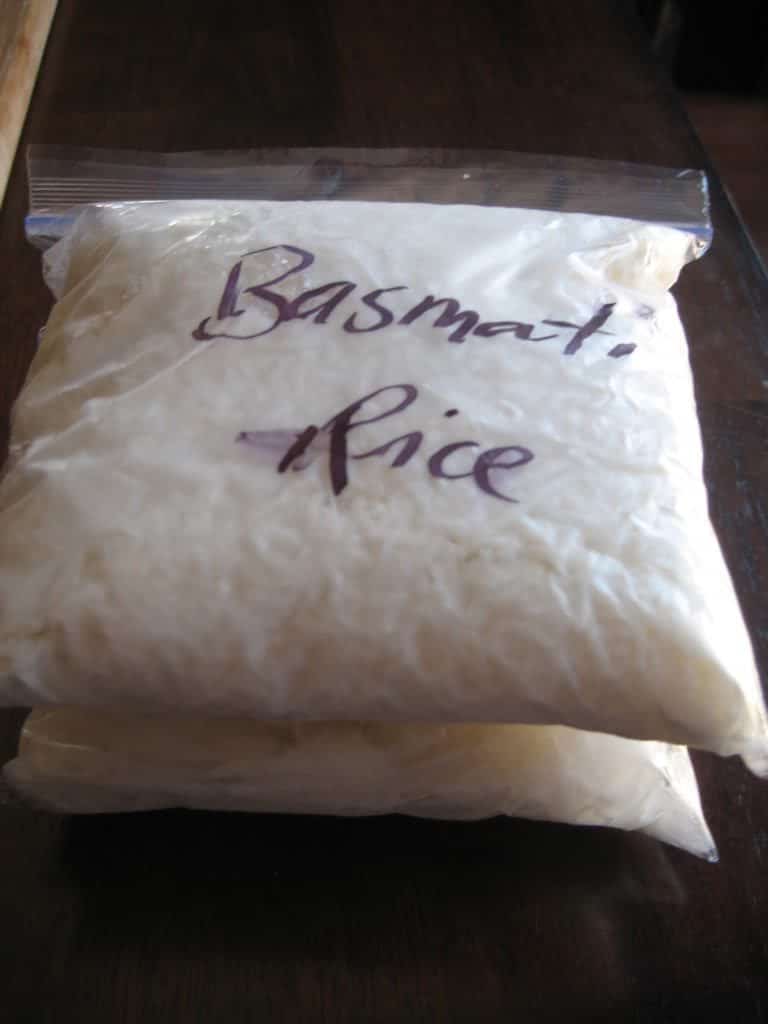 ziploc bags full of cooked rice marked with basmati rice