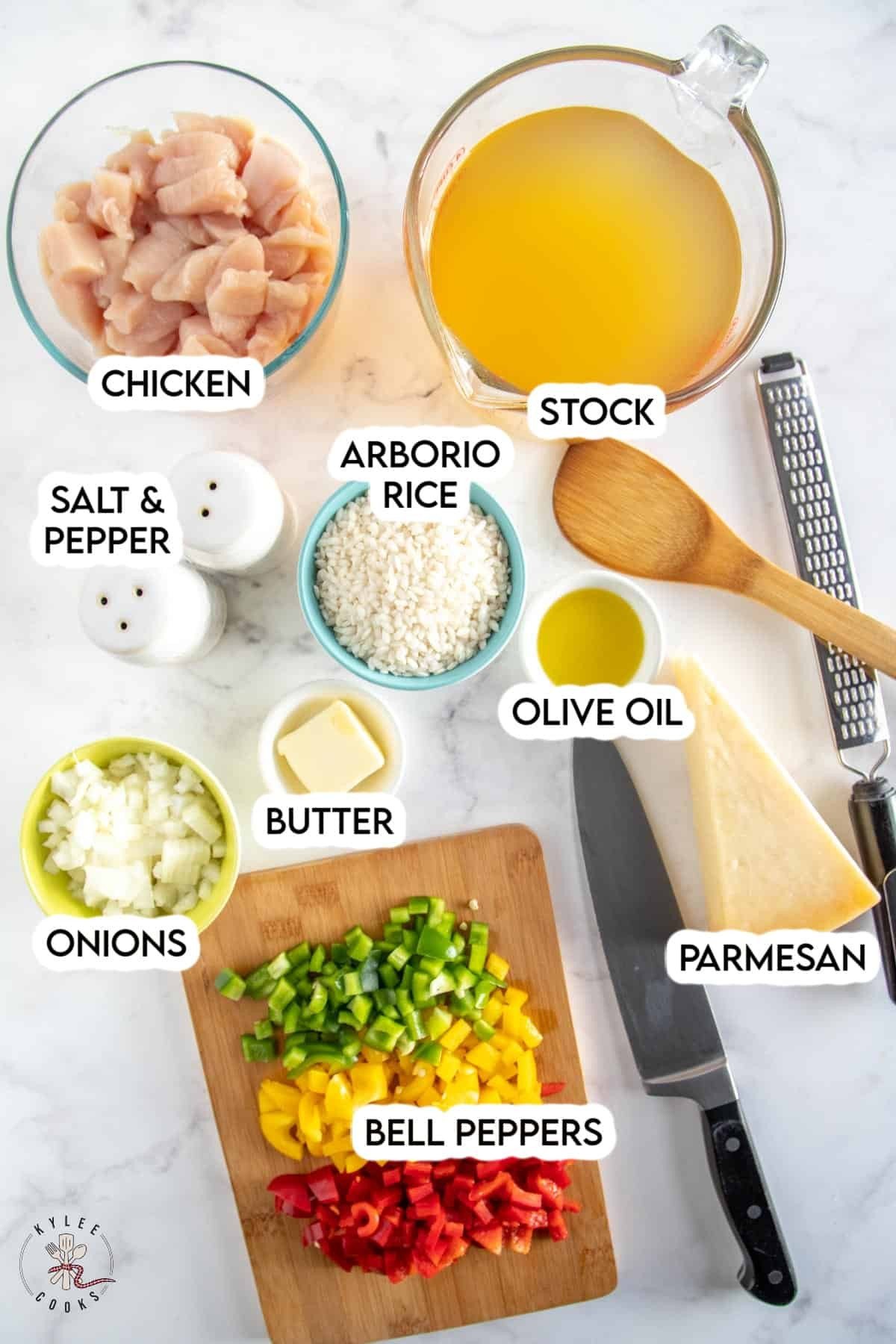 ingredients to make chicken risotto laid out and labeled.