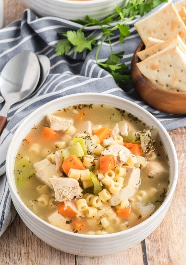 chicken noodle soup in a white bowl