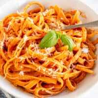 tomato cream sauce on pasta with basil
