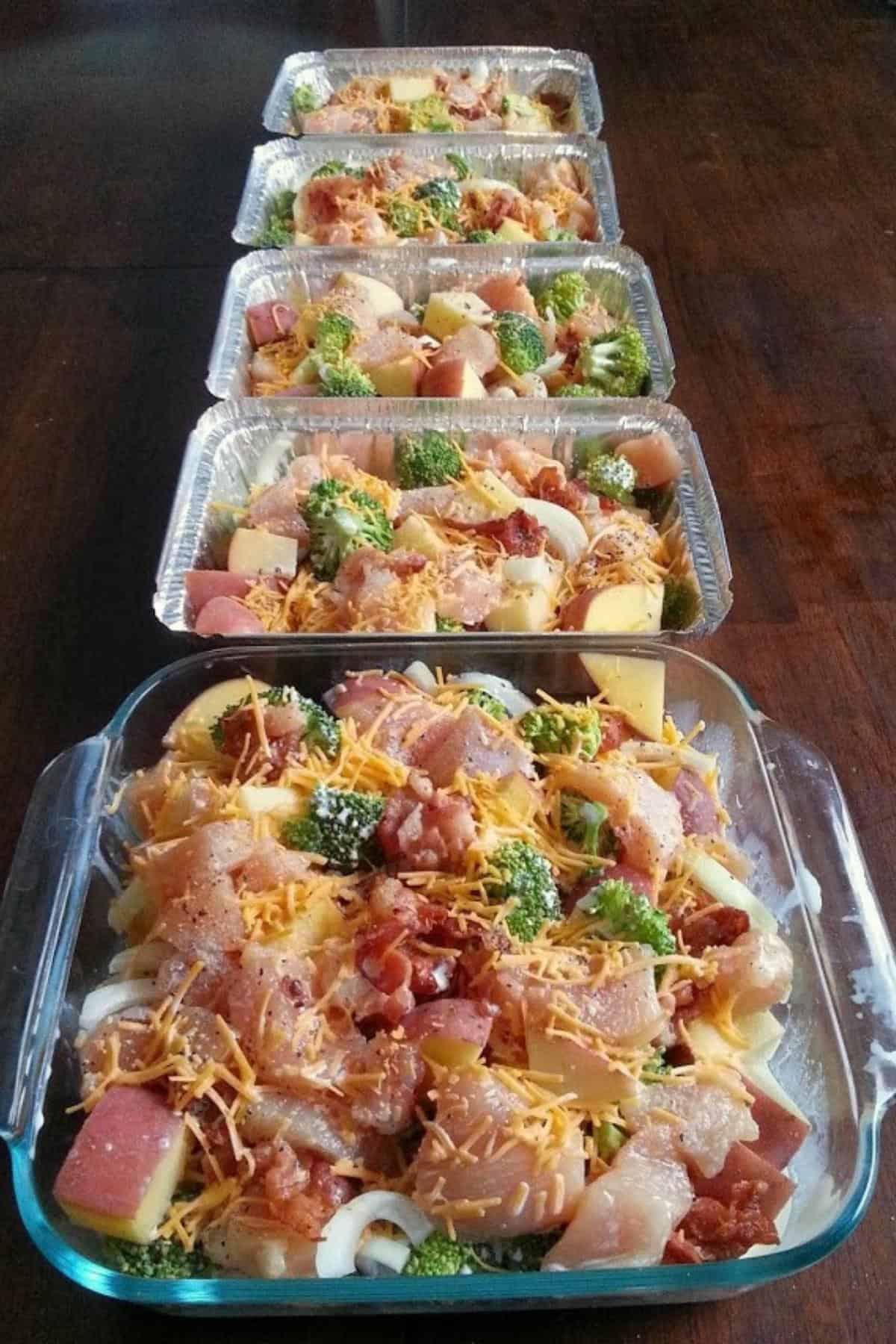 Chicken broccoli bacon potato bake lined up in baking dishes