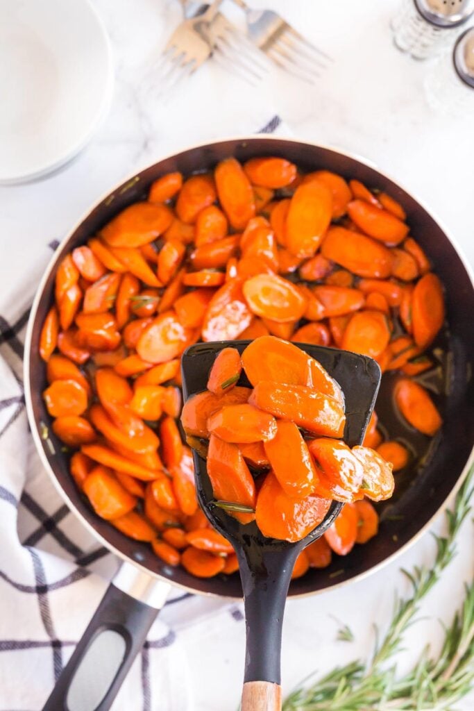 cooked carrots in a skillet