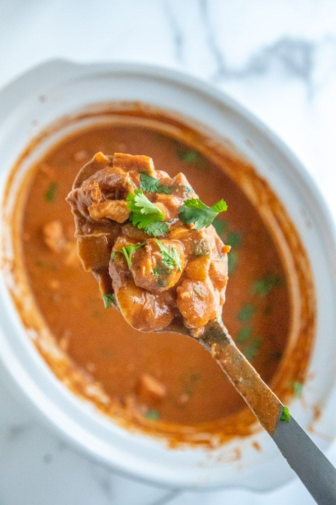 Chicken Tikka Masala - in a crockpot with a spoon showing detail