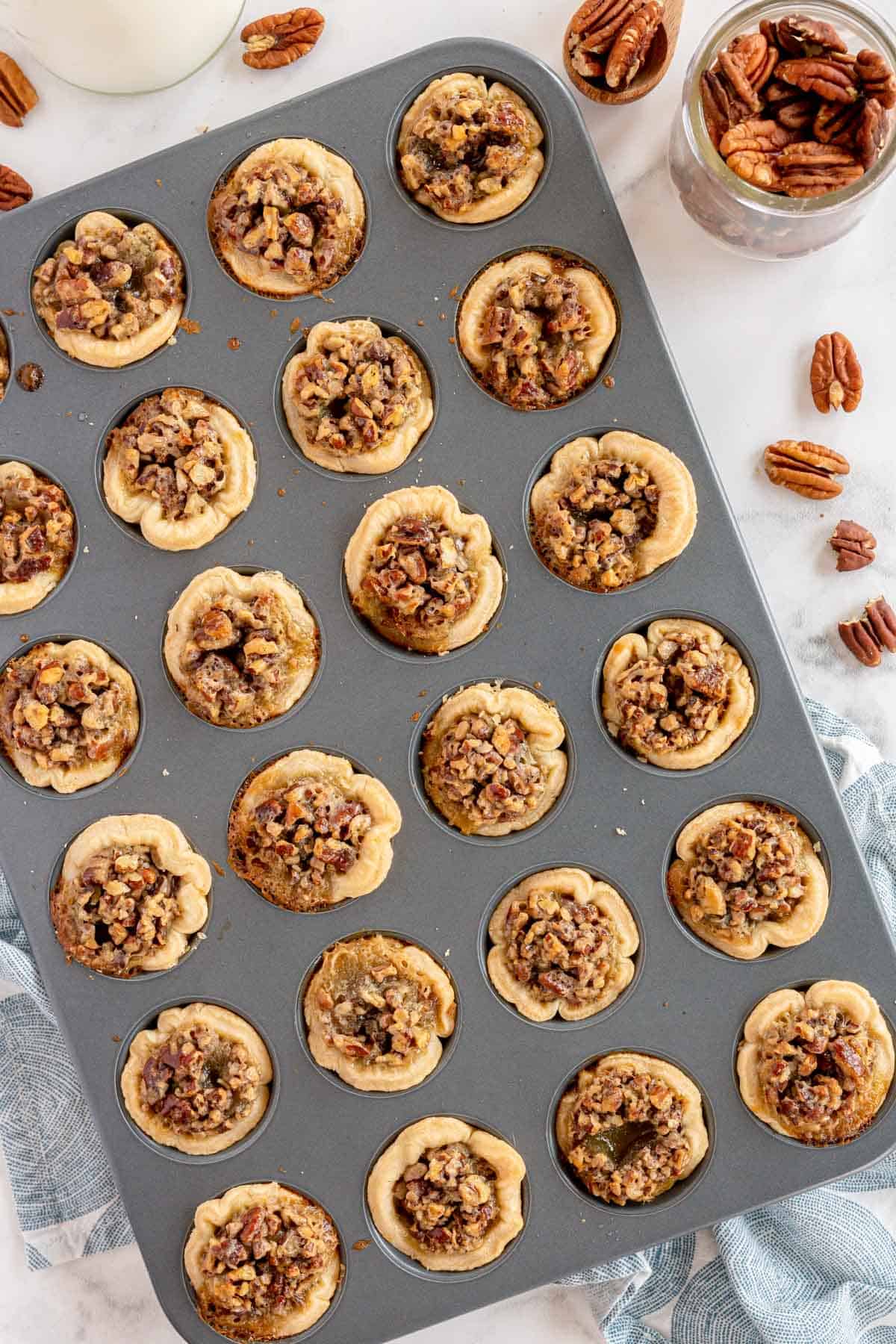 baked pecan pies in a muffin tin
