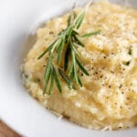 bowl of parmesan polenta with rosemary.
