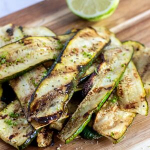 grilled zucchini on a chopping board.