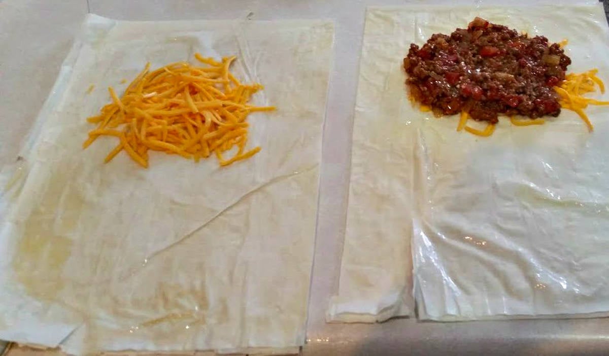 process showing how to assemble a phyllo meat pie.