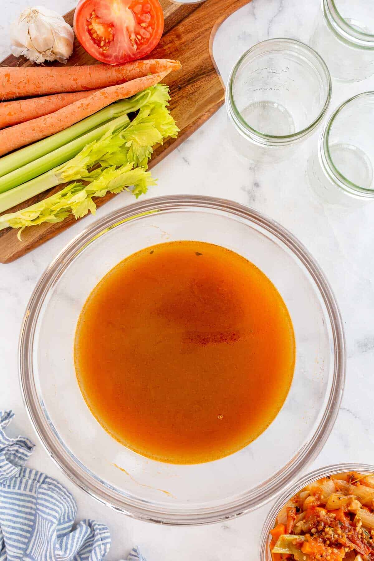 vegetable stock in a bowl after being strained