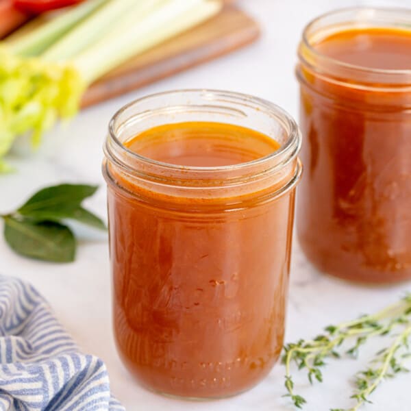vegetable stock in a jar with celery
