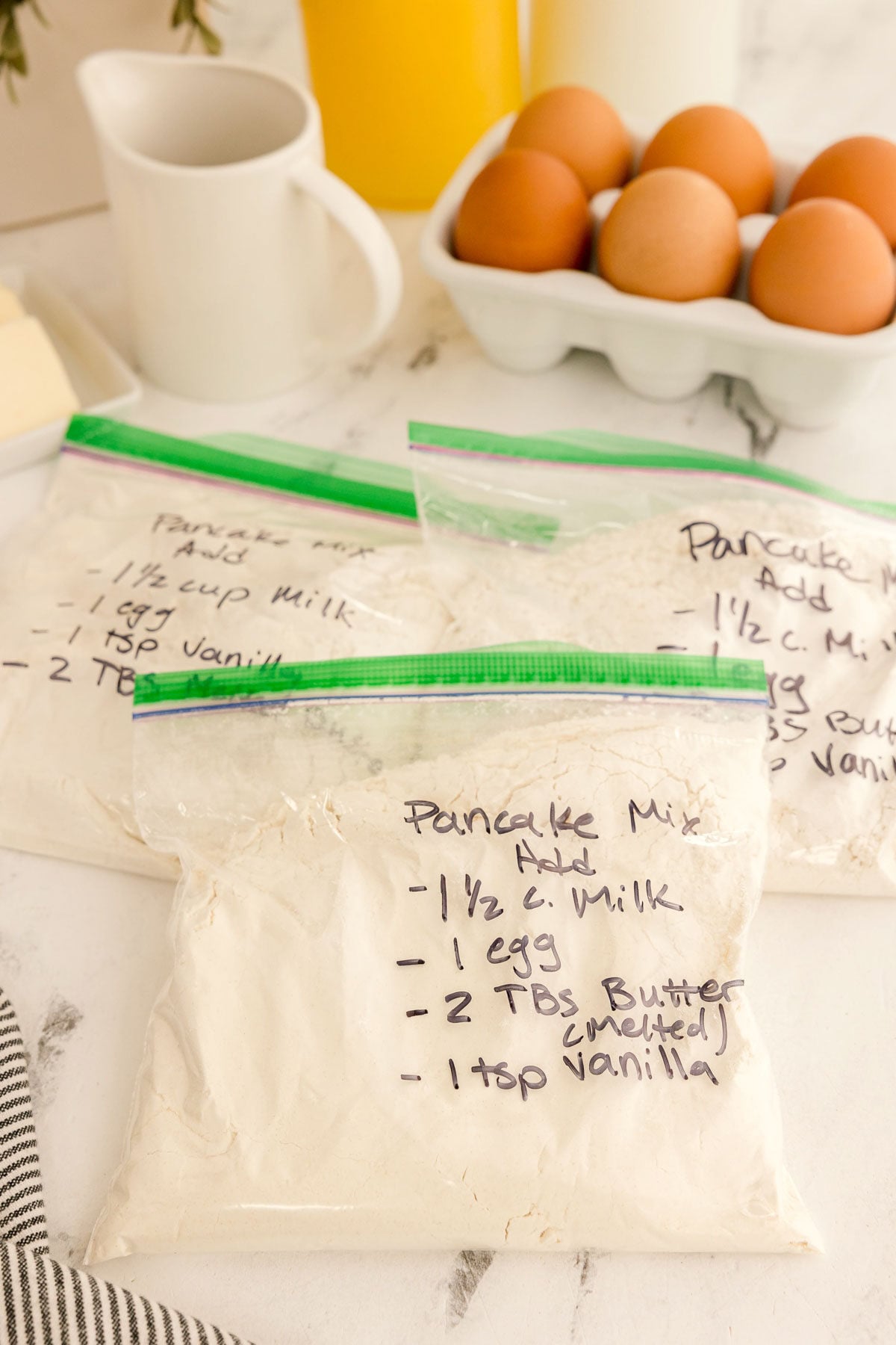 baggies of homemade pancake mix labeled with additional ingredients