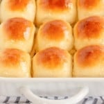 bread rolls in a white baking pan