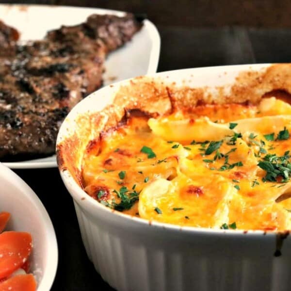 a dinner table with scalloped potatoes
