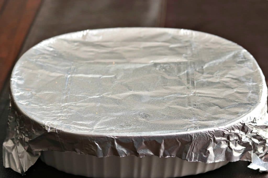 scalloped potatoes in a baking dish covered with foil