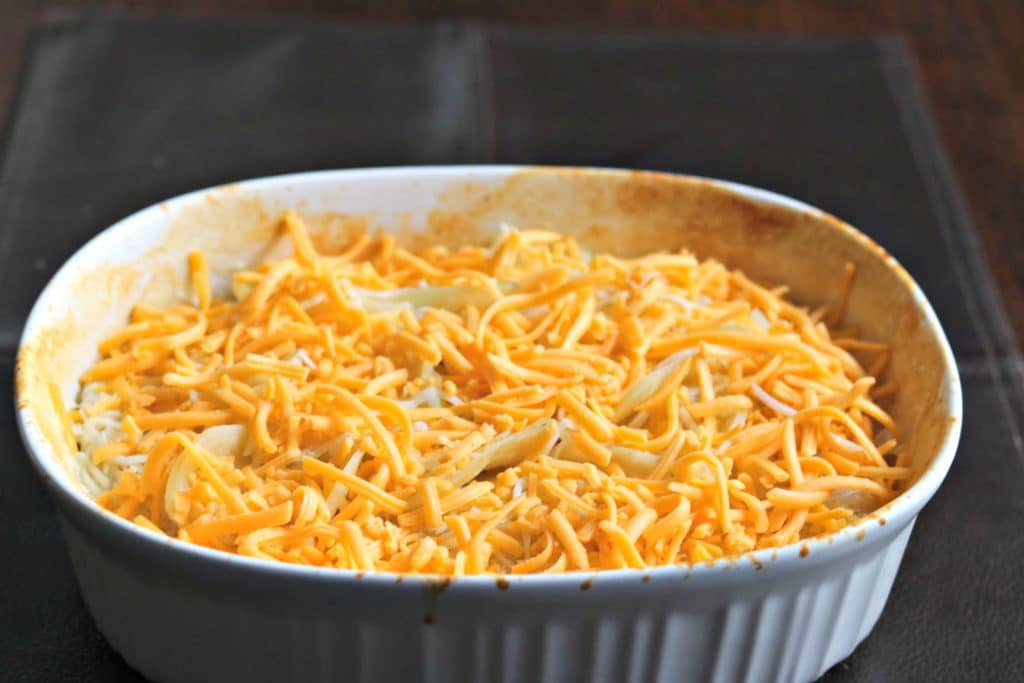 unbaked scalloped potatoes in a baking dish