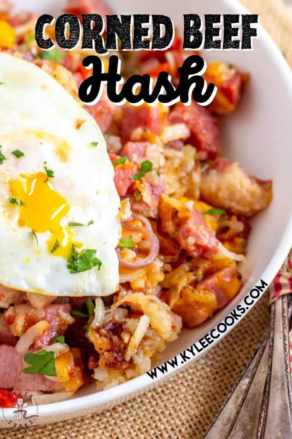 corned beef hash in a skillet with fried eggs with recipe name overlaid in text