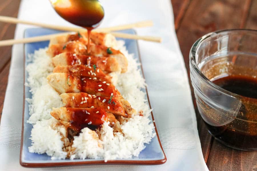 teriyaki sauce poured over chicken and rice