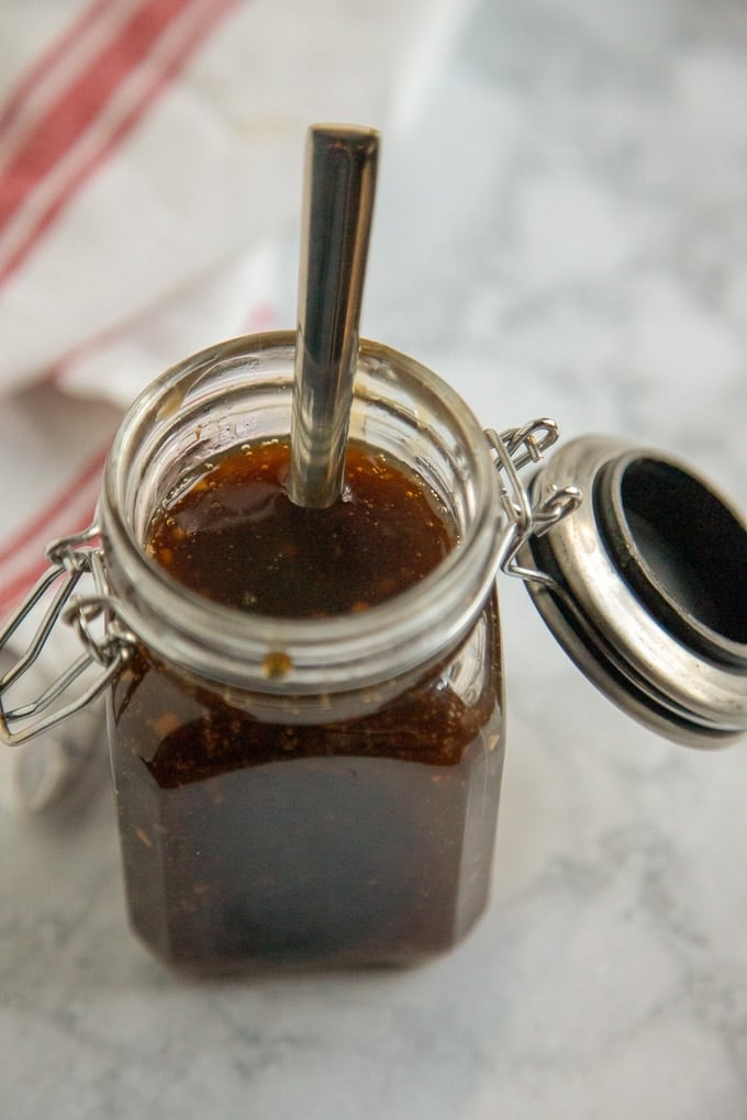 teriyaki sauce in a glass jar with a spoon