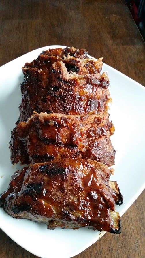 a rack of cooked ribs cut into 3 