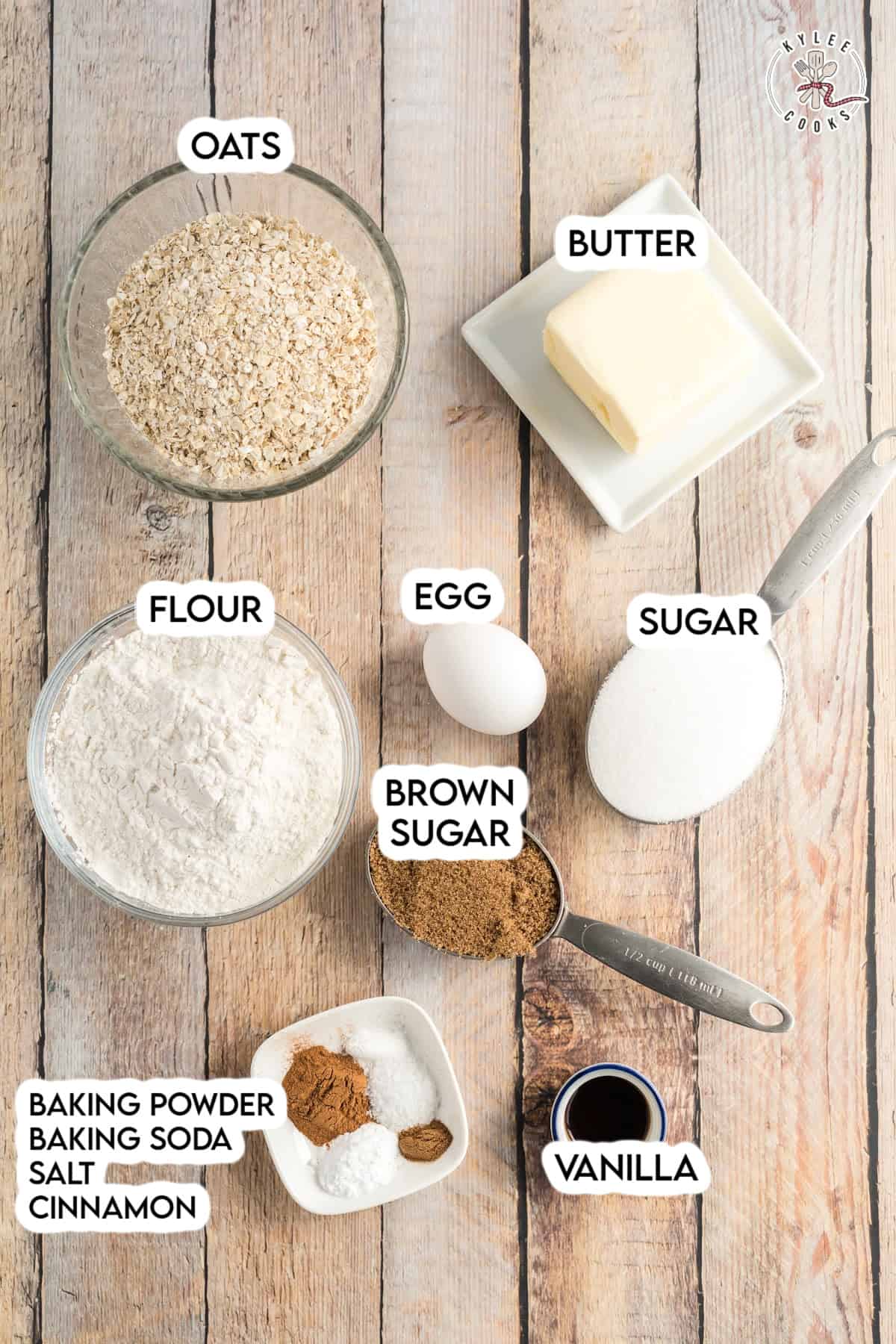 ingredients in oatmeal cookies laid out on a board with labels
