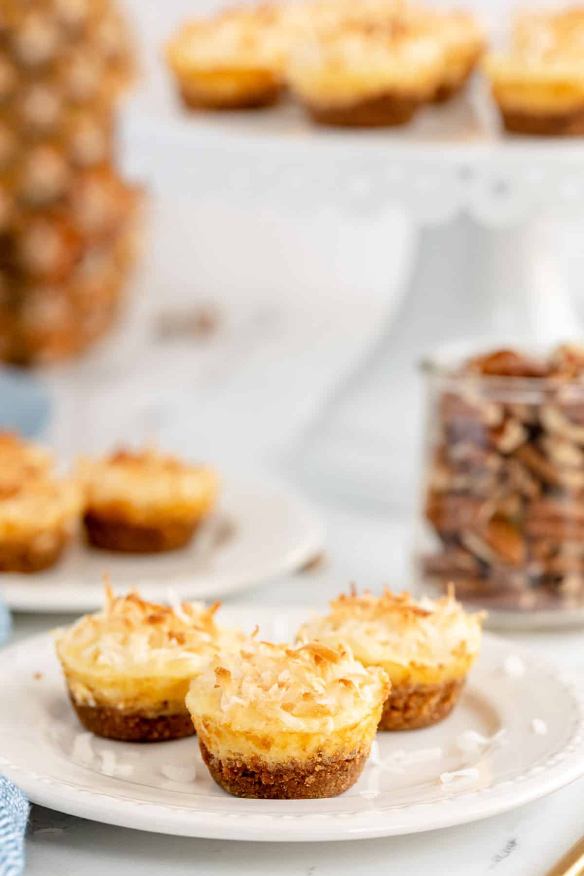 Pineapple Cheesecake bites on a white plate.