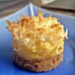 Pineapple coconut mini cheesecakes on a blue plate