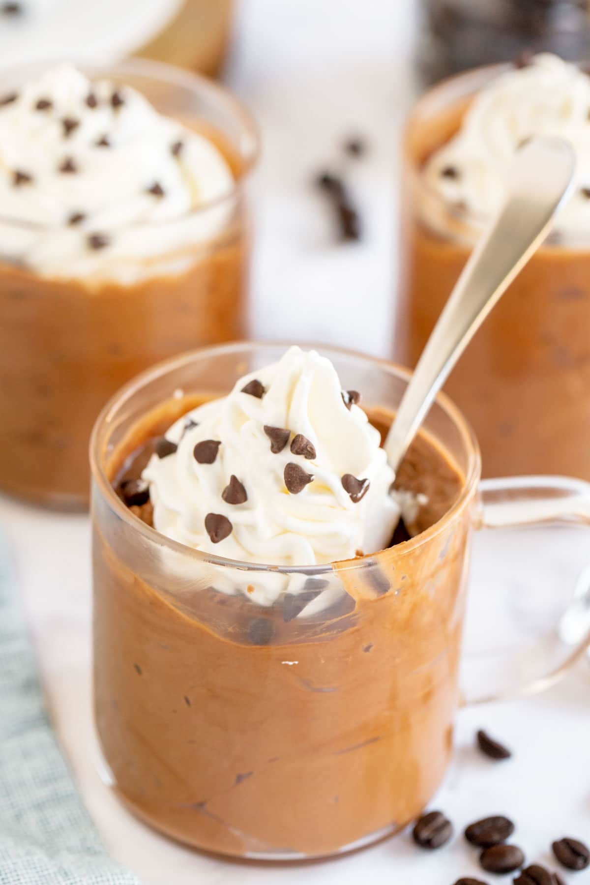 coffee mousse in a glass cup with whipped cream and chocolate