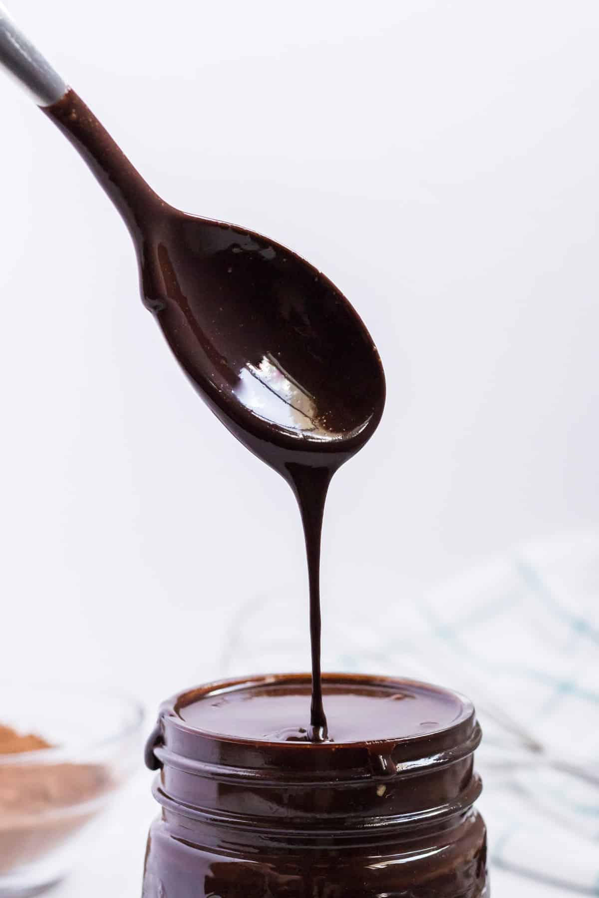 chocolate syrup dripping off a spoon