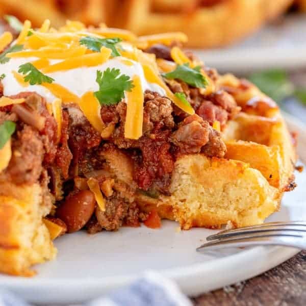 cornbread waffle with chili on top, cut open