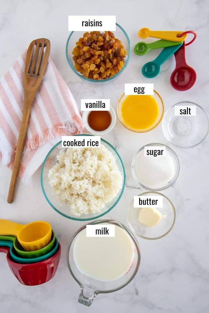 ingredients for rice pudding laid out labeled
