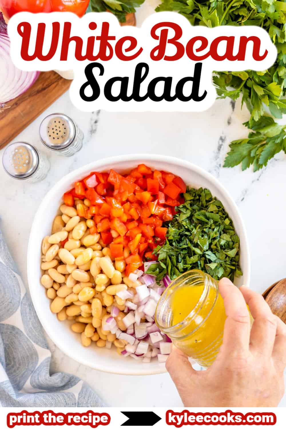 white bean salad in a bowl with recipe name listed in text overlay.