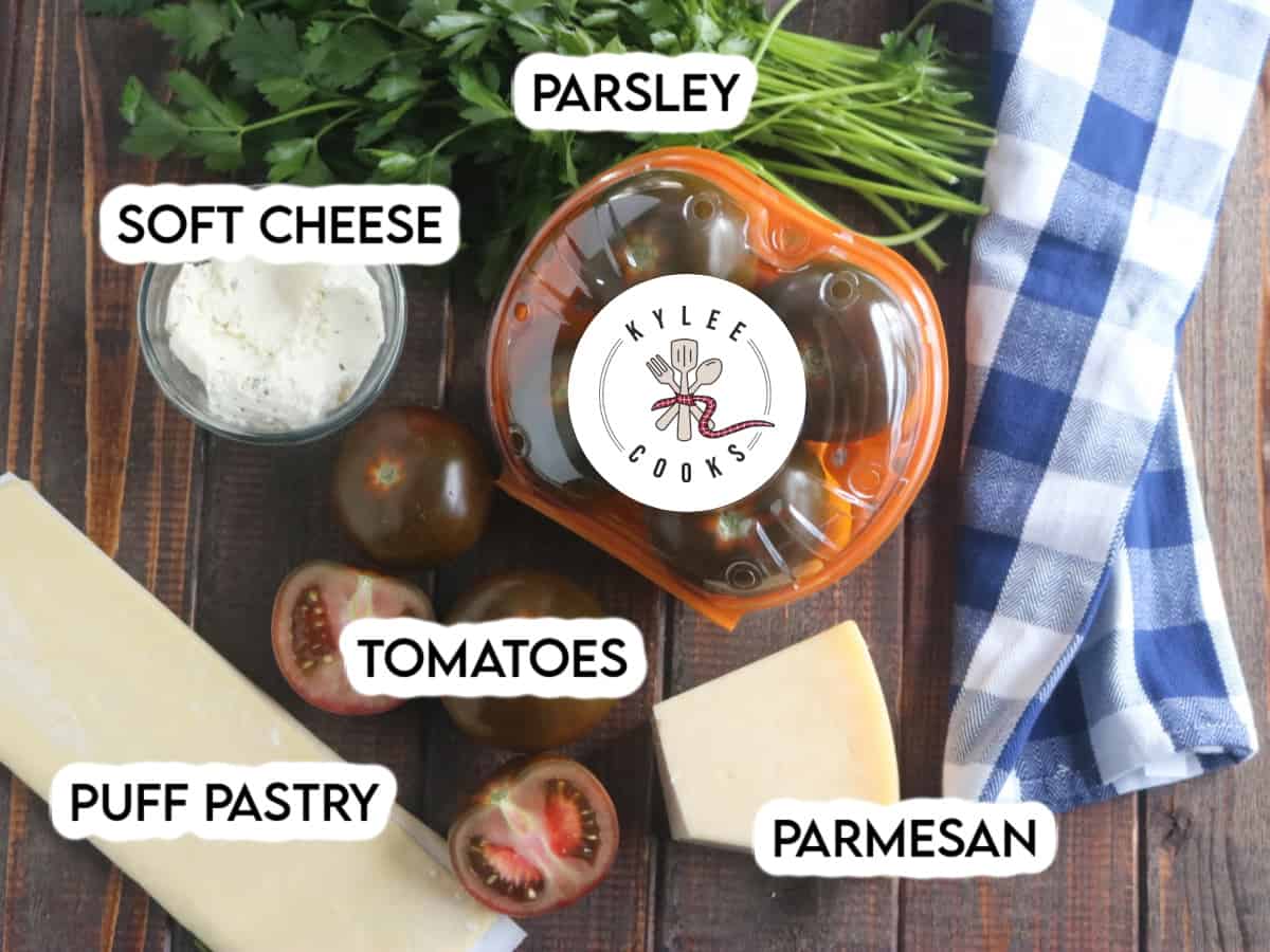 Ingredients to make puff pastry tomato tart laid out and labeled.