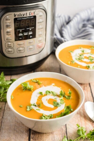 butternut squash soup in a bowl with an instant pot