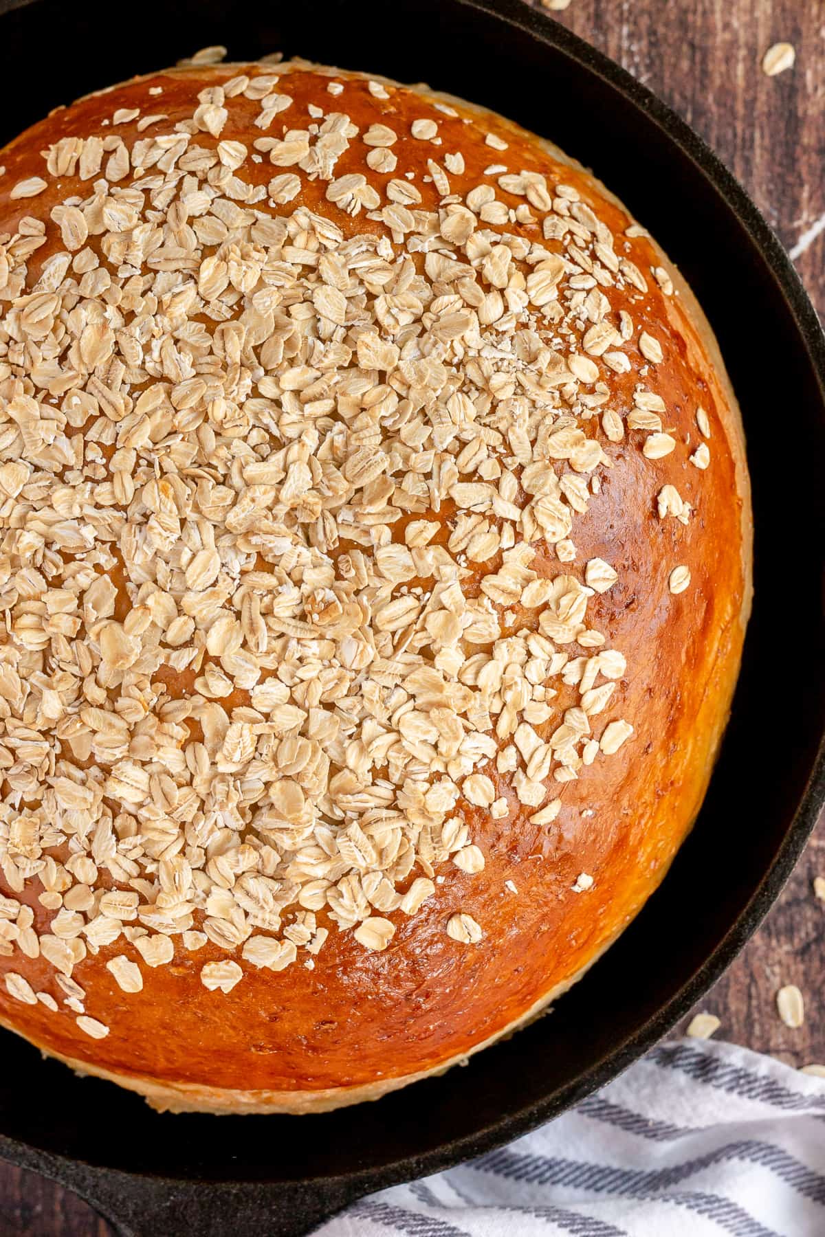 baked oat bread in a cast iron skillet