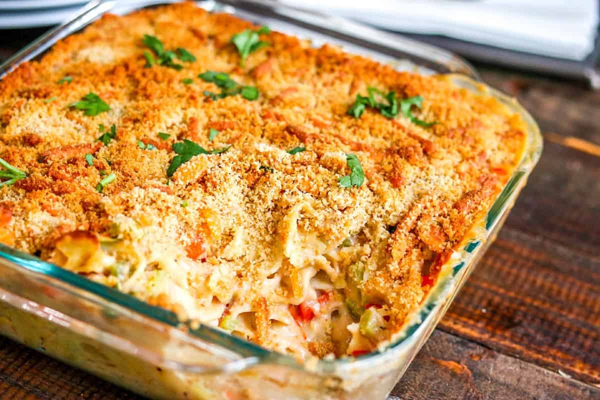 tuna noodle casserole with a spoon scooping food out