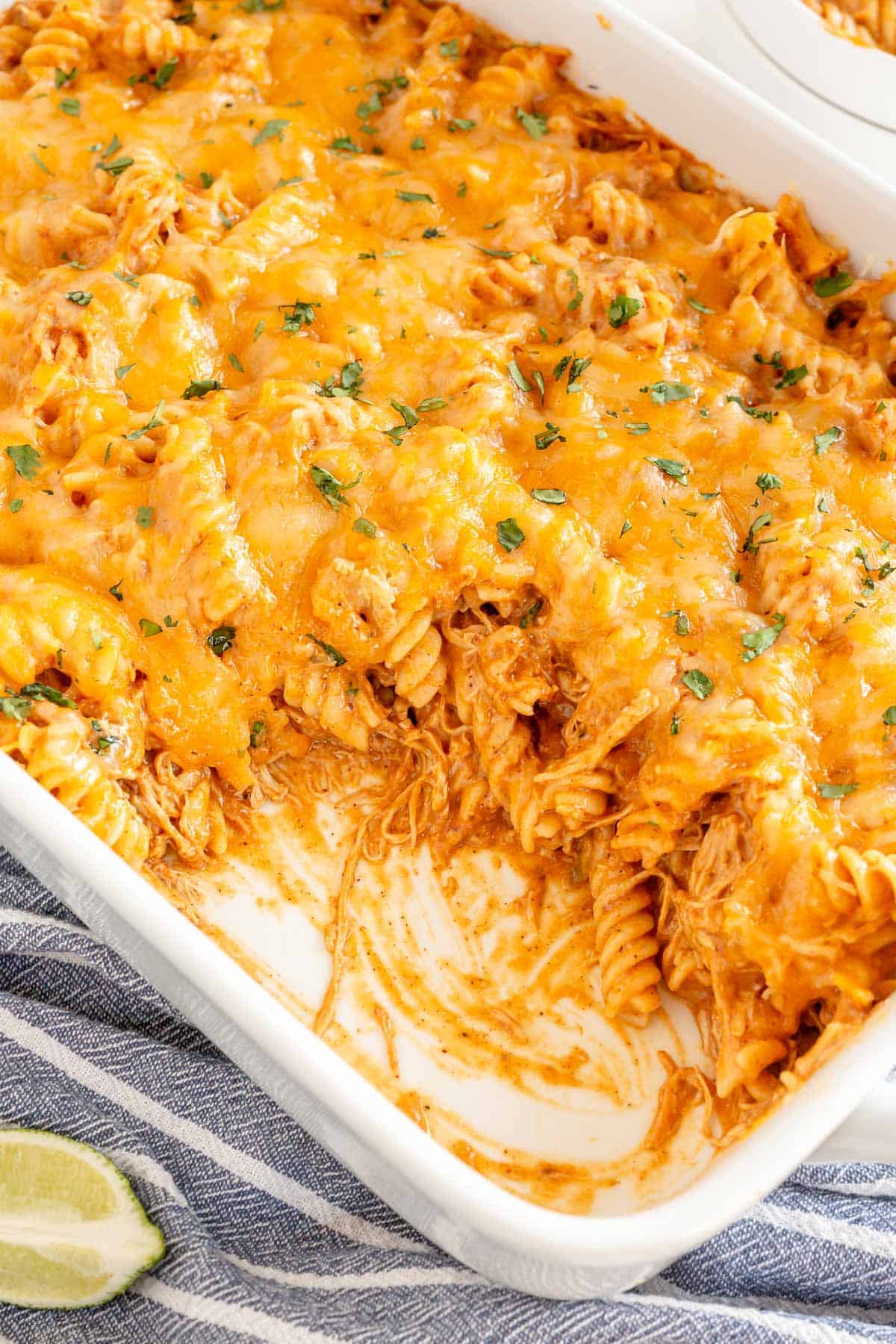 enchilada pasta in a white dish with some removed