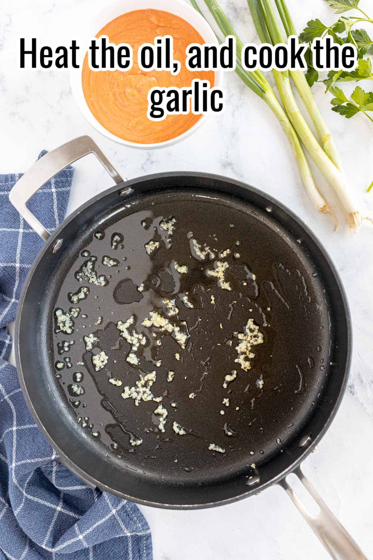 Cooking garlic in a frying pan.