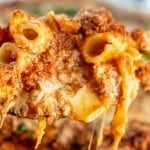 close of up baked ziti being scooped