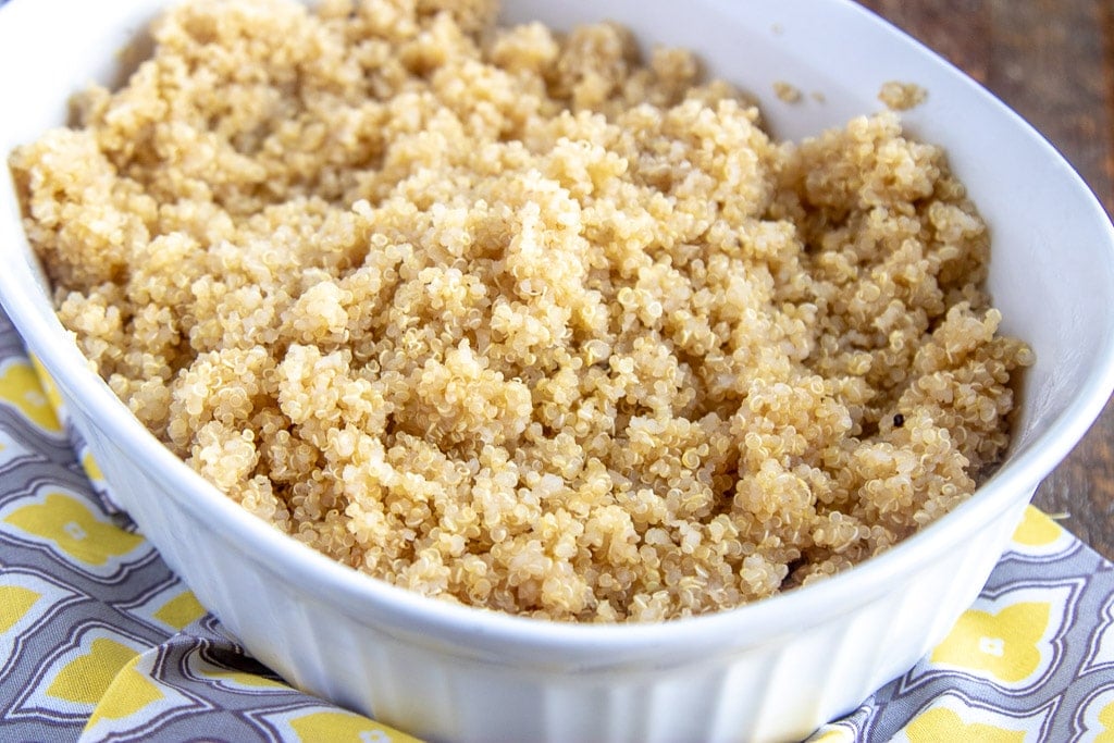 cooked quinoa in a white serving dish