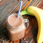 coffee smoothie in a mason jar with a banana