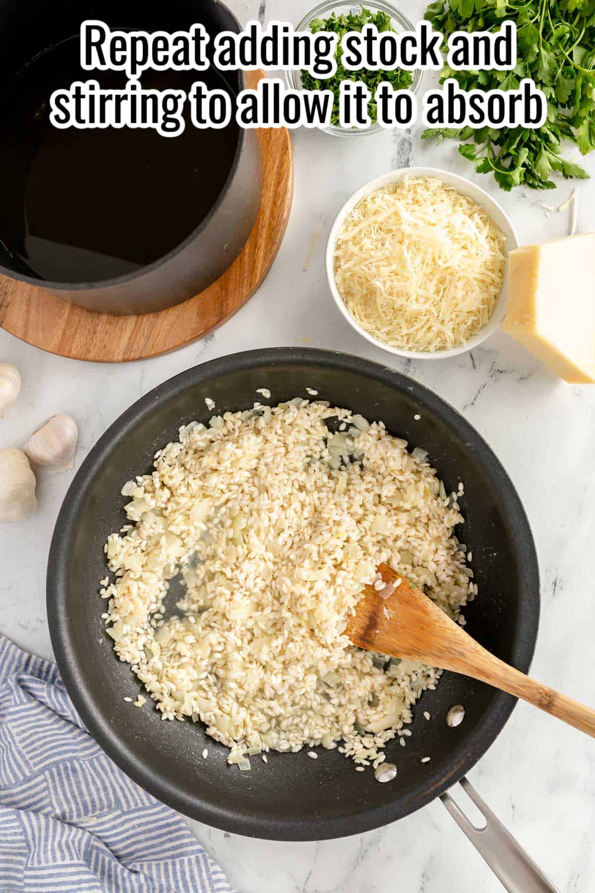 a black skillet with almost cooked risotto.