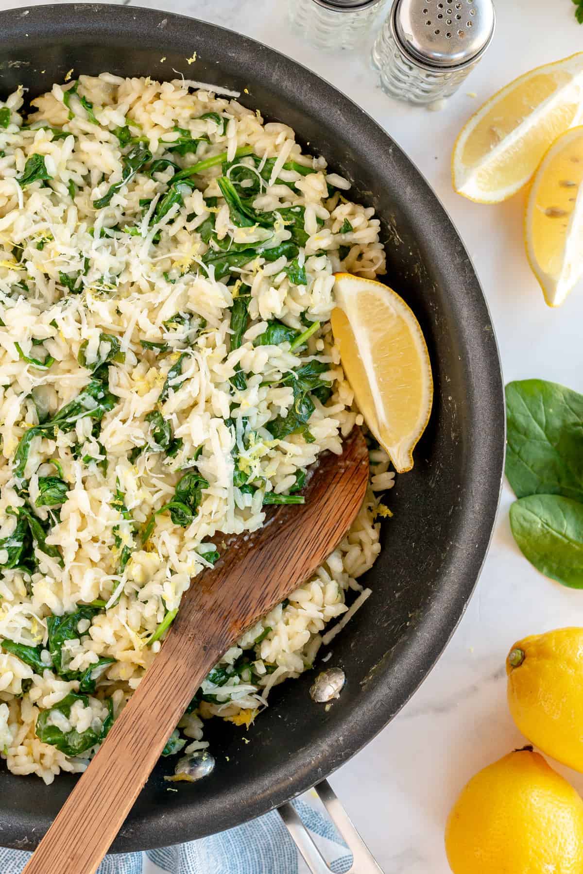 spinach risotto with lemon in a large skillet