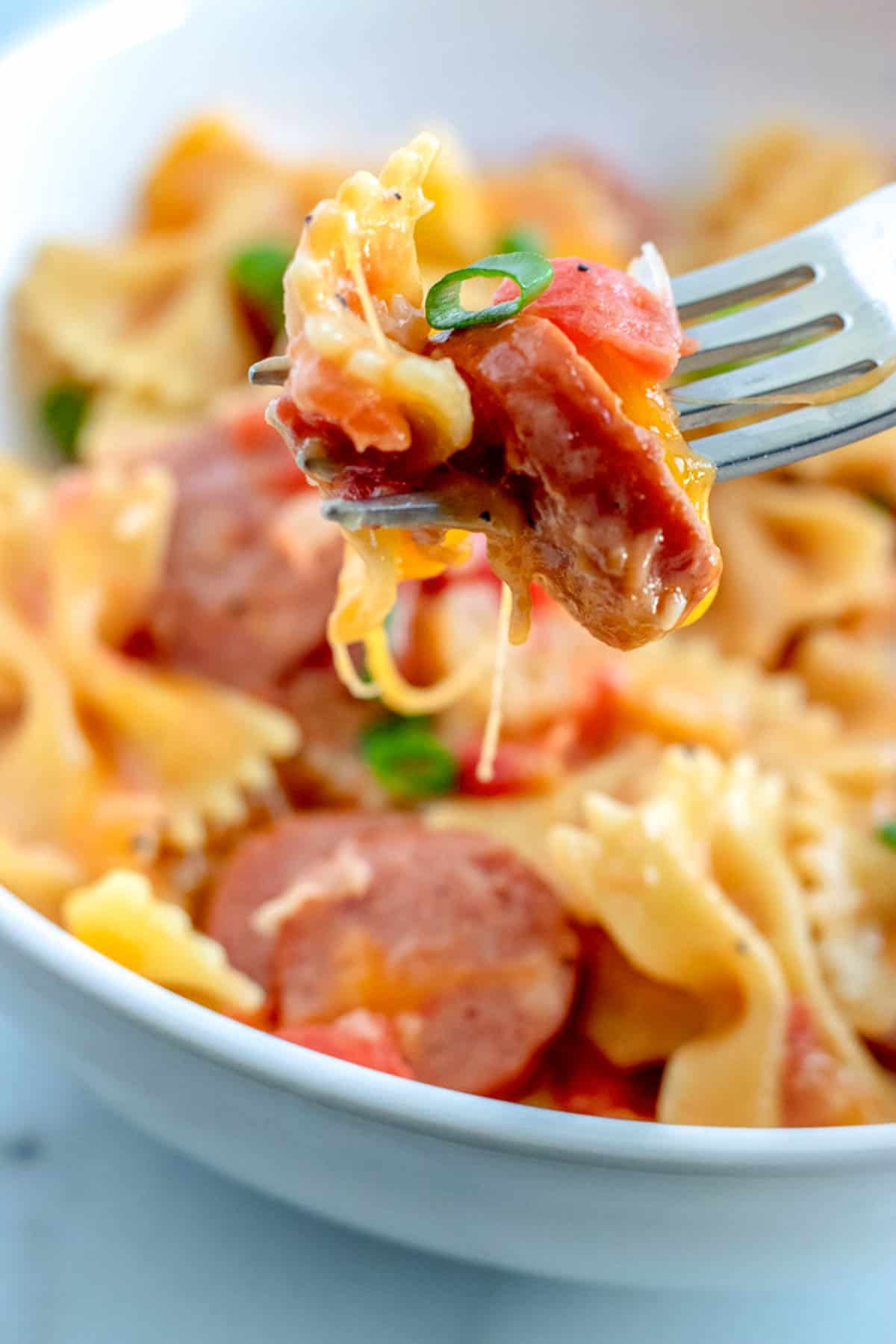 close up of Sausage pasta on a fork
