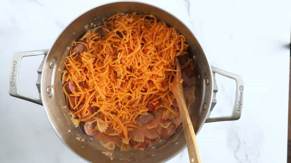 smoked sausage pasta with cheddar sprinkled over the top.