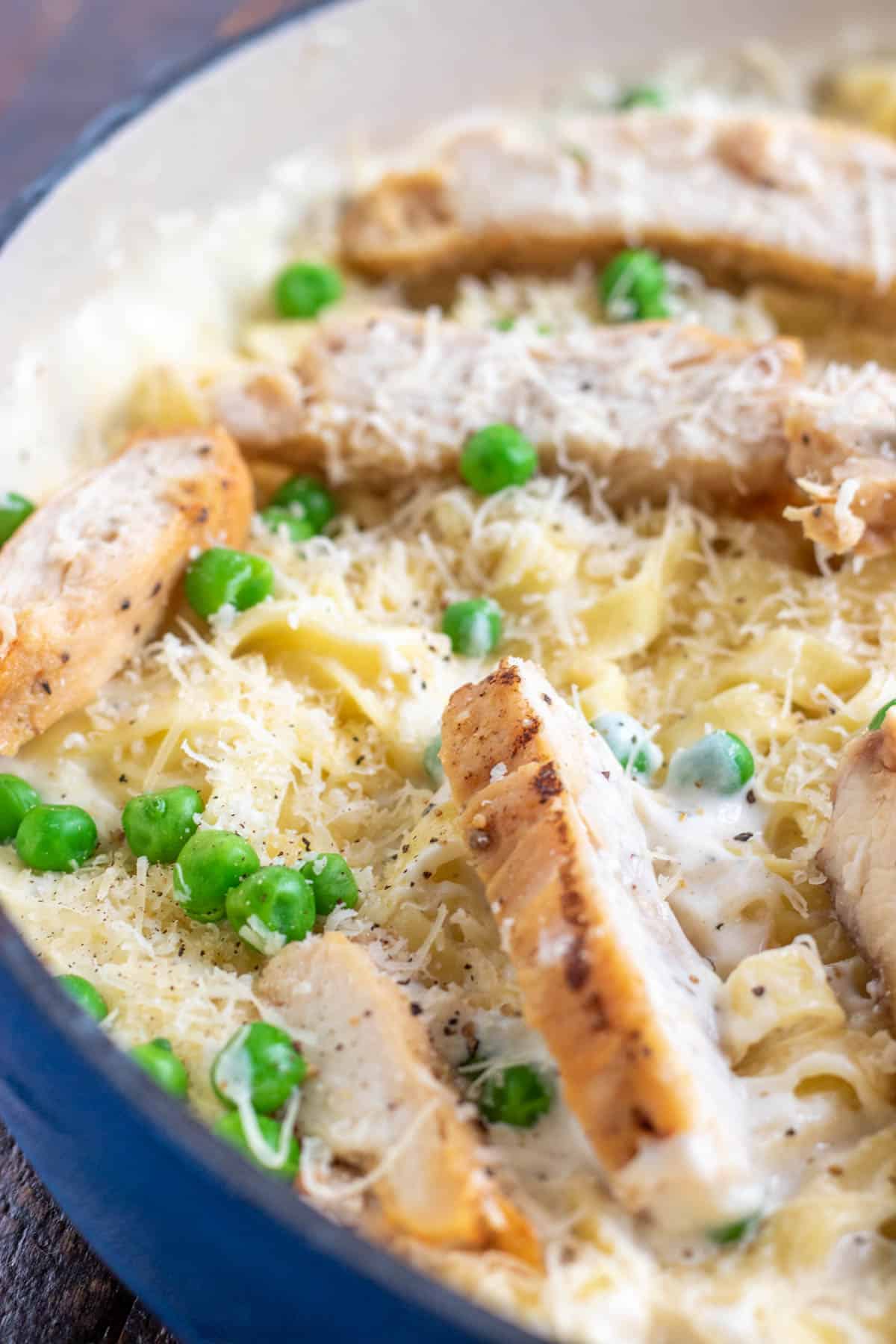skillet with fettuccine alfredo with chicken and peas