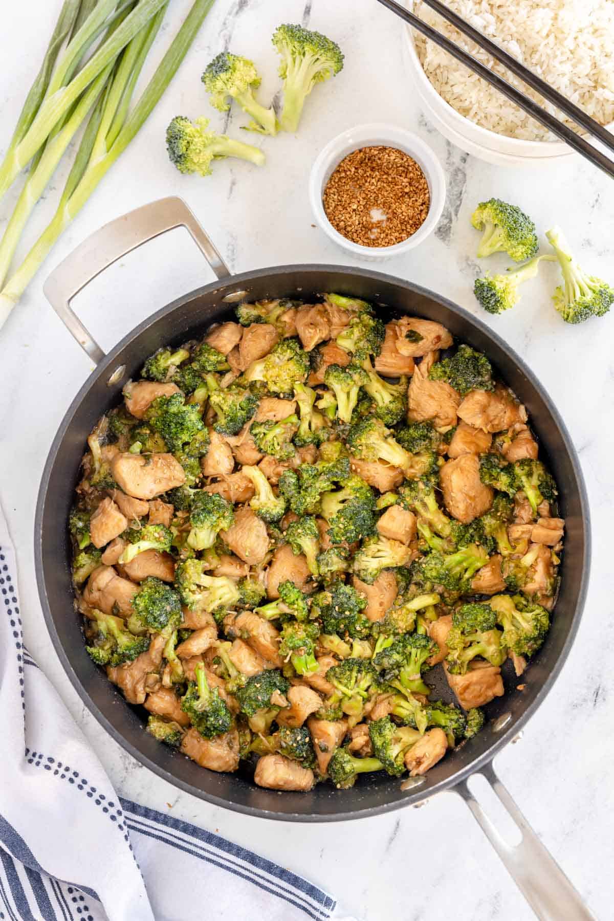 chicken broccoli stir fry in a wok.
