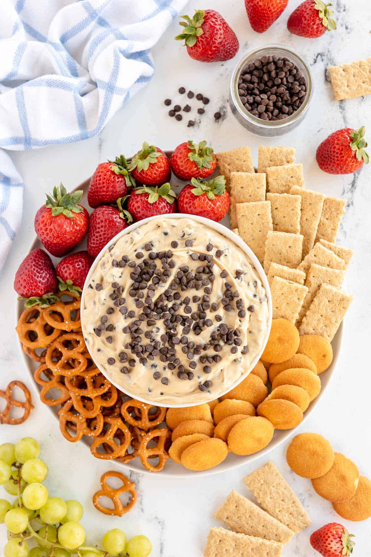 Chocolate chip cookie dough dip with strawberries and pretzels. Keywords: Cookie Dough Dip
